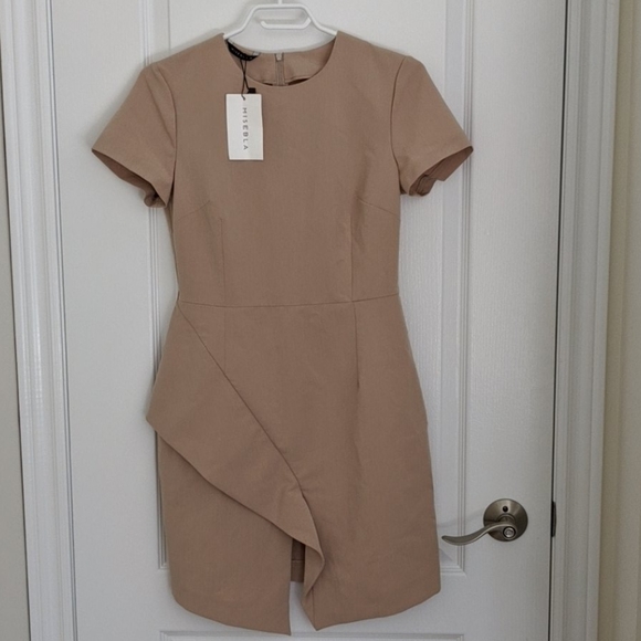 Misebla Dresses & Skirts - NWT beige dress with peplum side and front slit